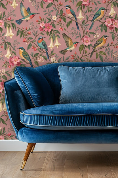 Bedroom wall covered with dusty rose wallpaper featuring vintage floral and bird illustration behind a bed