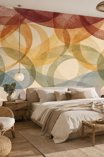 Bedroom featuring terracotta and ochre layered loop wallpaper behind bed with neutral bedding and wooden furniture