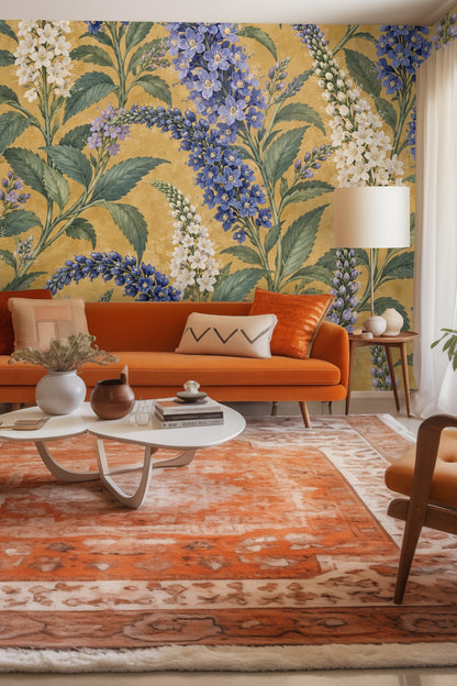 Wallpaper pattern detail featuring blue, lavender, and white delphinium floral spikes with green leaves on mustard background.