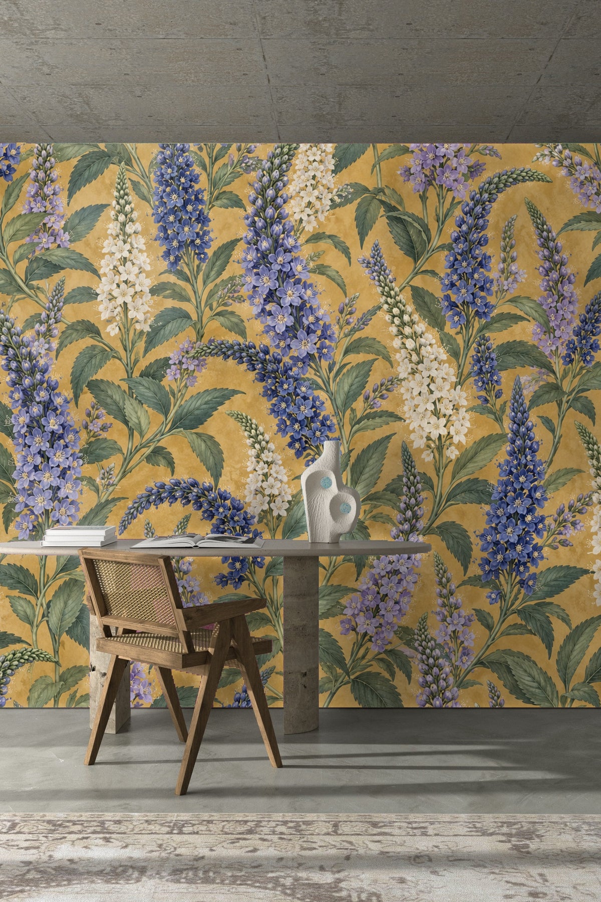 Detailed floral wallpaper featuring elongated spires of cobalt and white blossoms accompanied by detailed green leaves on mustard base.