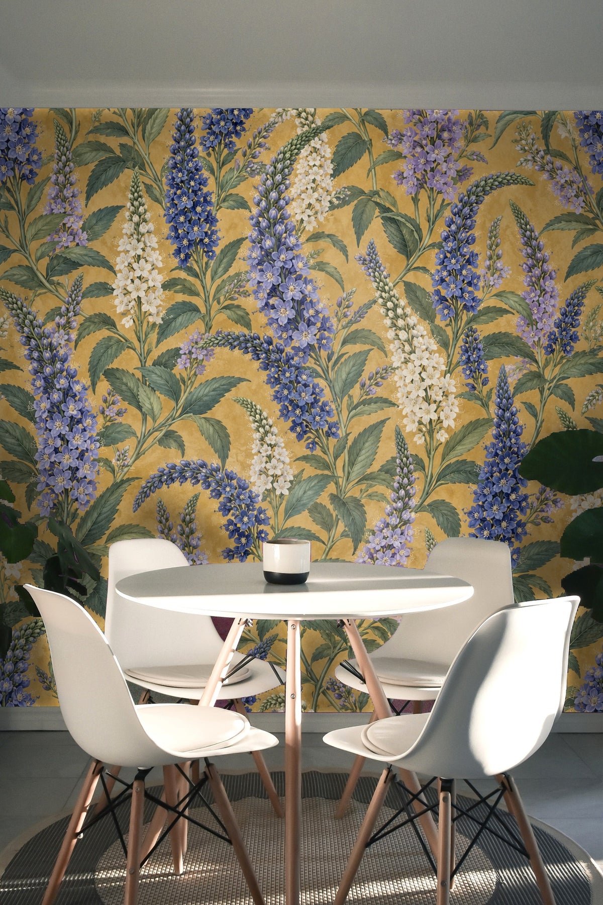 Section of wallpaper showing layered vertical floral spikes in blue and cream shades with a textured yellow background.