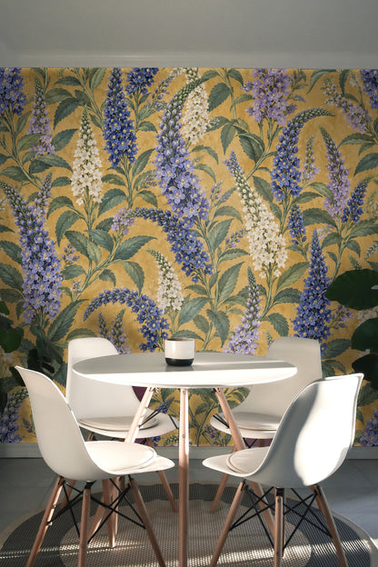 Section of wallpaper showing layered vertical floral spikes in blue and cream shades with a textured yellow background.
