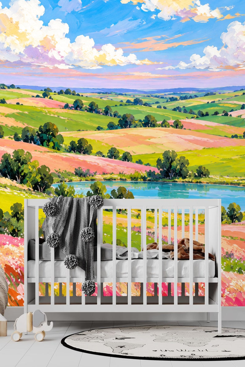 Living room wall with a mural of rolling green hills and colorful fields behind a cream sofa and pendant light