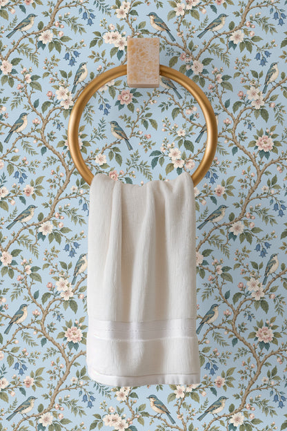 Wallpaper pattern showing clusters of blooming flowers and foliage