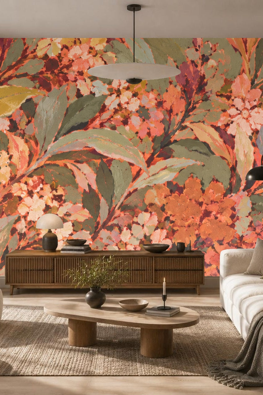 Close-up detail of apricot and coral floral wallpaper with olive green leaves