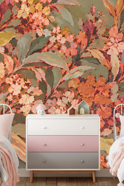 Wallpapered nursery room with twin pink beds and a white chest of drawers