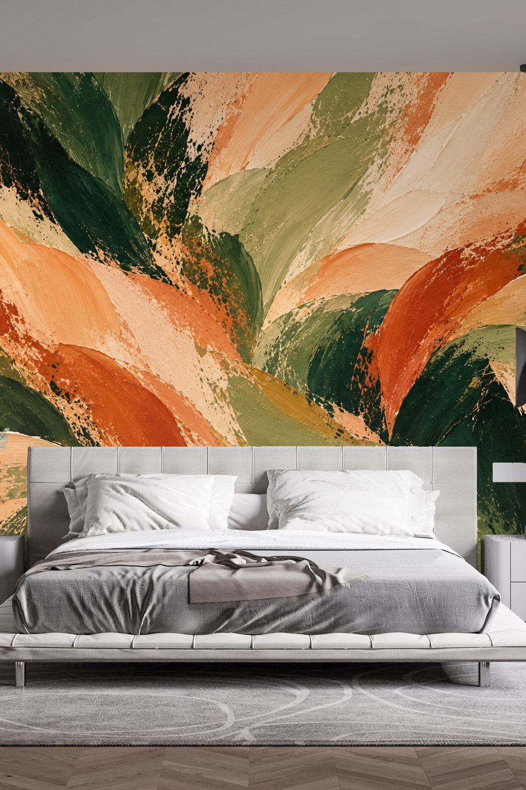 Wide shot of wall with painterly leaf wallpaper creating rich, natural ambiance.