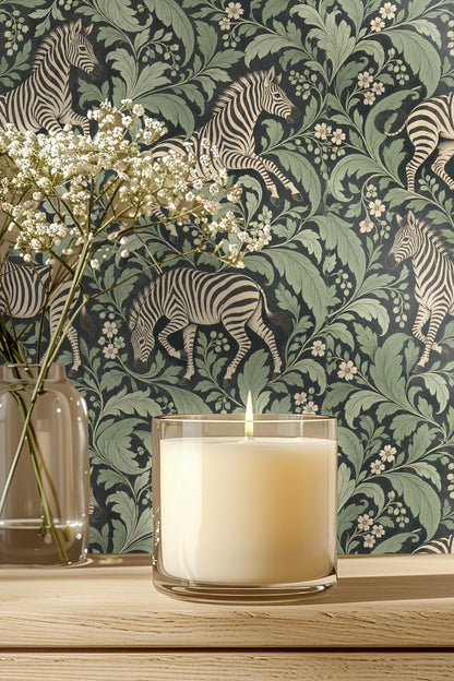 Wallpaper featuring zebras and green foliage on dark background viewed close-up