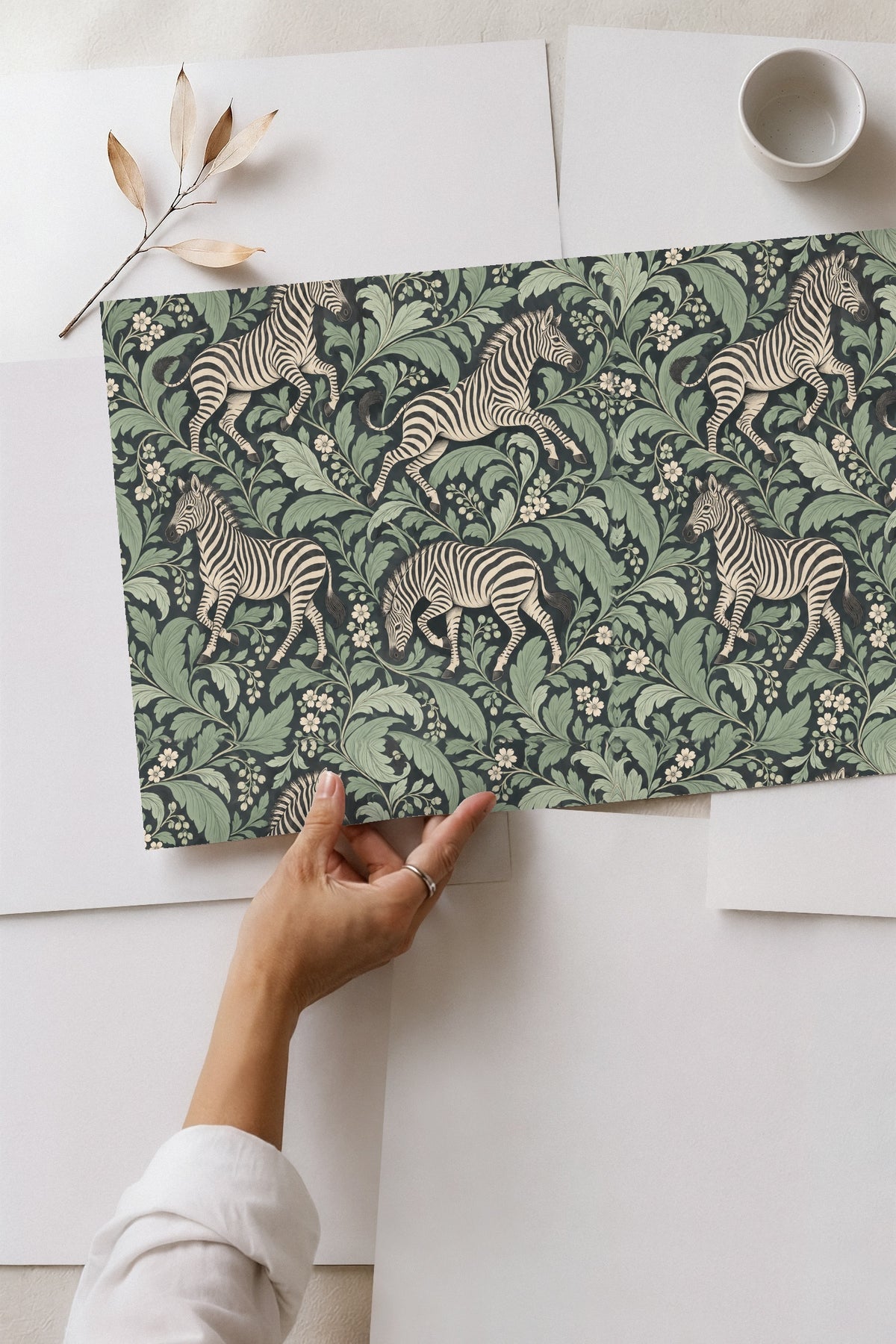 Zebra mid-leap on wallpaper surrounded by stylized leaves