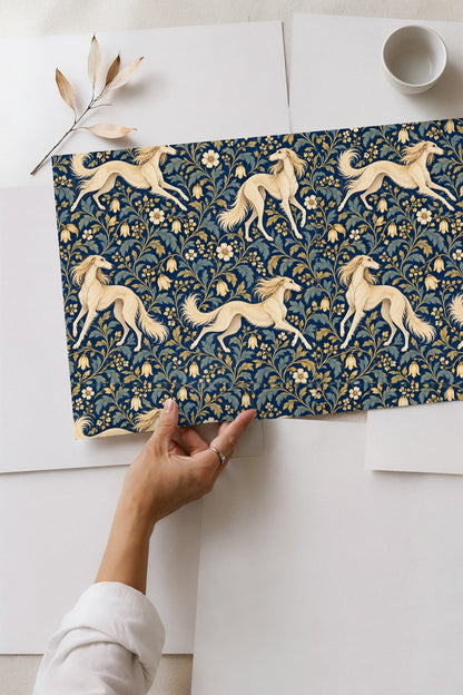 Washer and dryer under countertop with floral and dog wallpaper above.