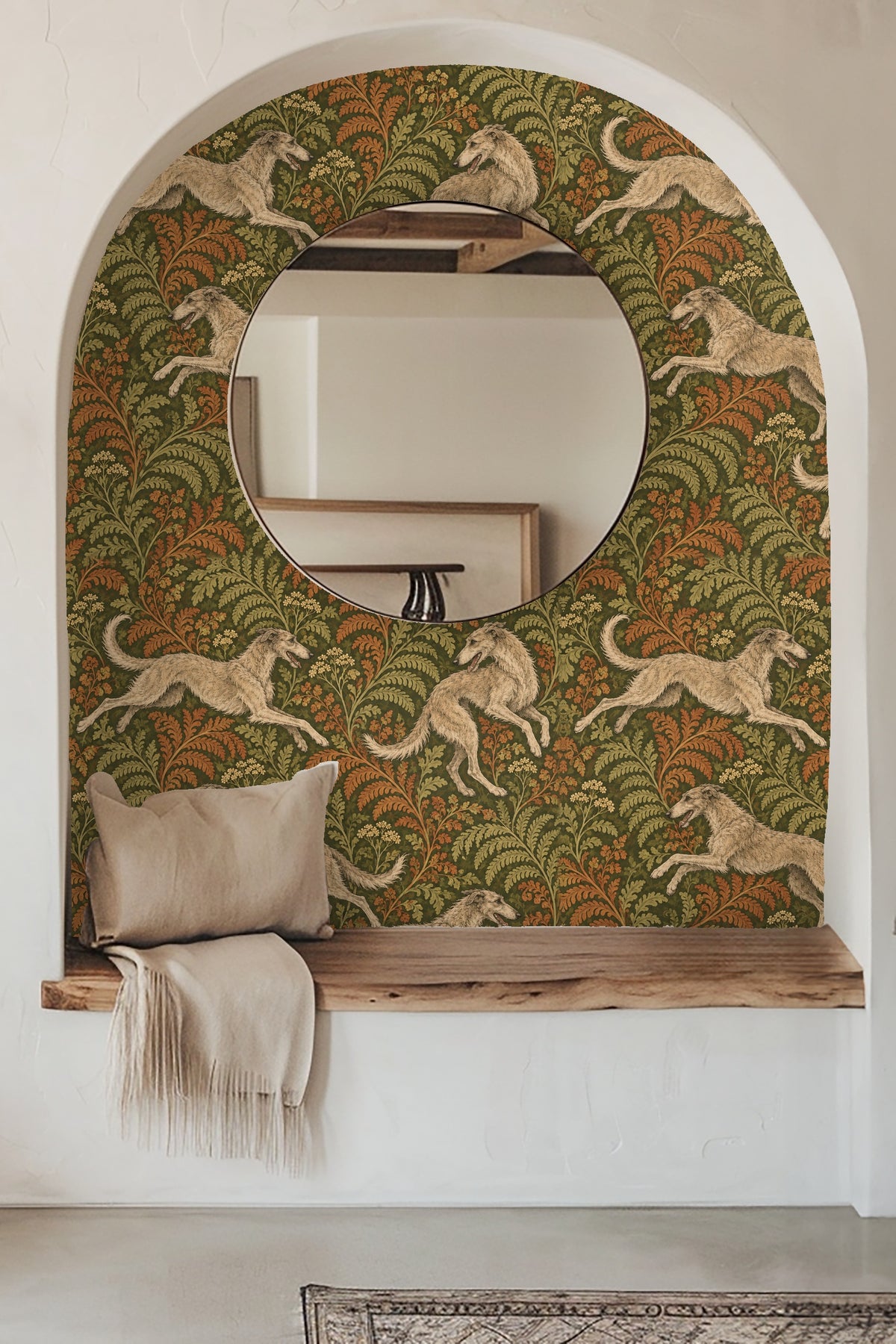 Living room corner featuring wallpaper with leaping hounds and detailed fern pattern behind a scented candle and flowers