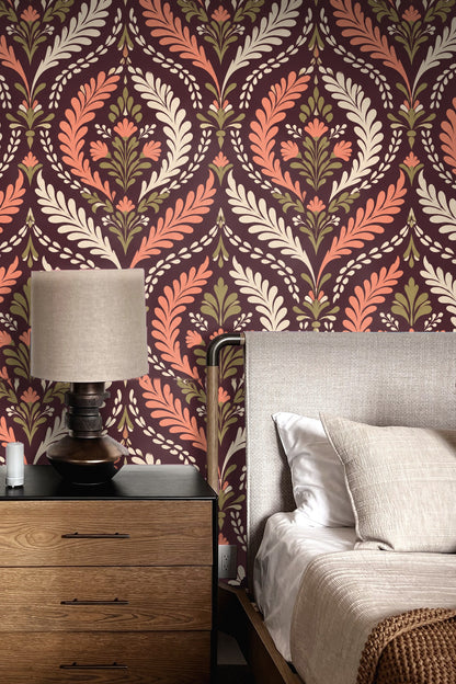 Bedroom scene with terracotta damask wallpaper behind bed showing scale and atmosphere