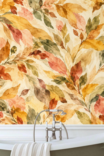 Muted green leaves blending with terracotta in watercolor brushstrokes