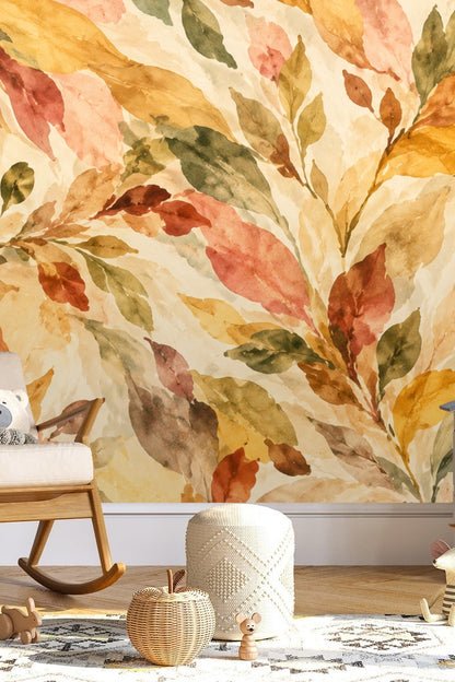 Watercolor wallpaper with flowing amber, terracotta, golden yellow, and green leaves on cream background