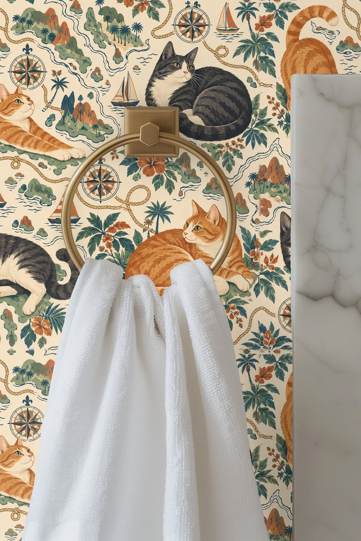 Wallpaper detail focusing on compass rose and rope motifs with a sitting gray tuxedo cat