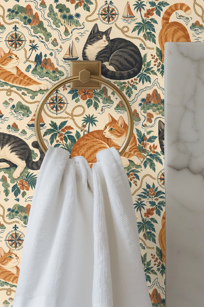 Wallpaper detail focusing on compass rose and rope motifs with a sitting gray tuxedo cat