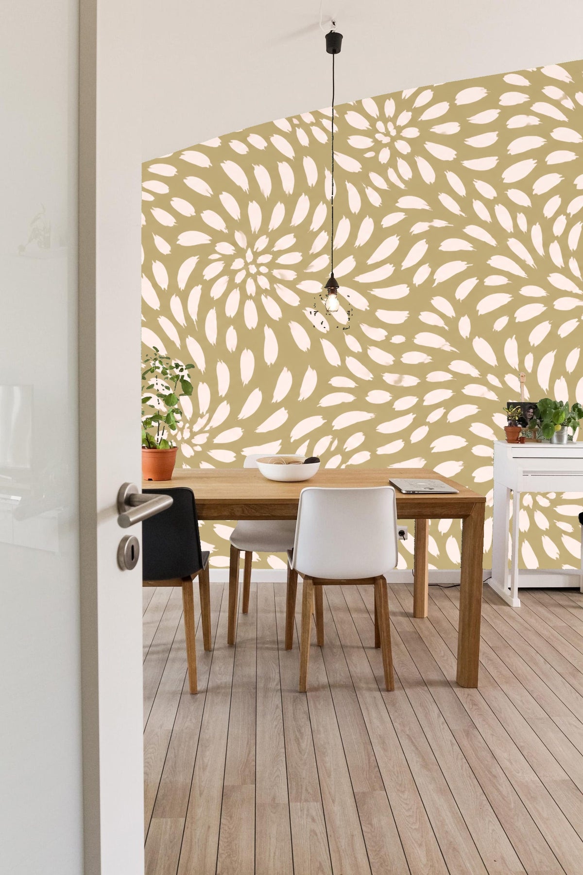 Child's play area wall with playful petal swirl wallpaper and wooden furniture
