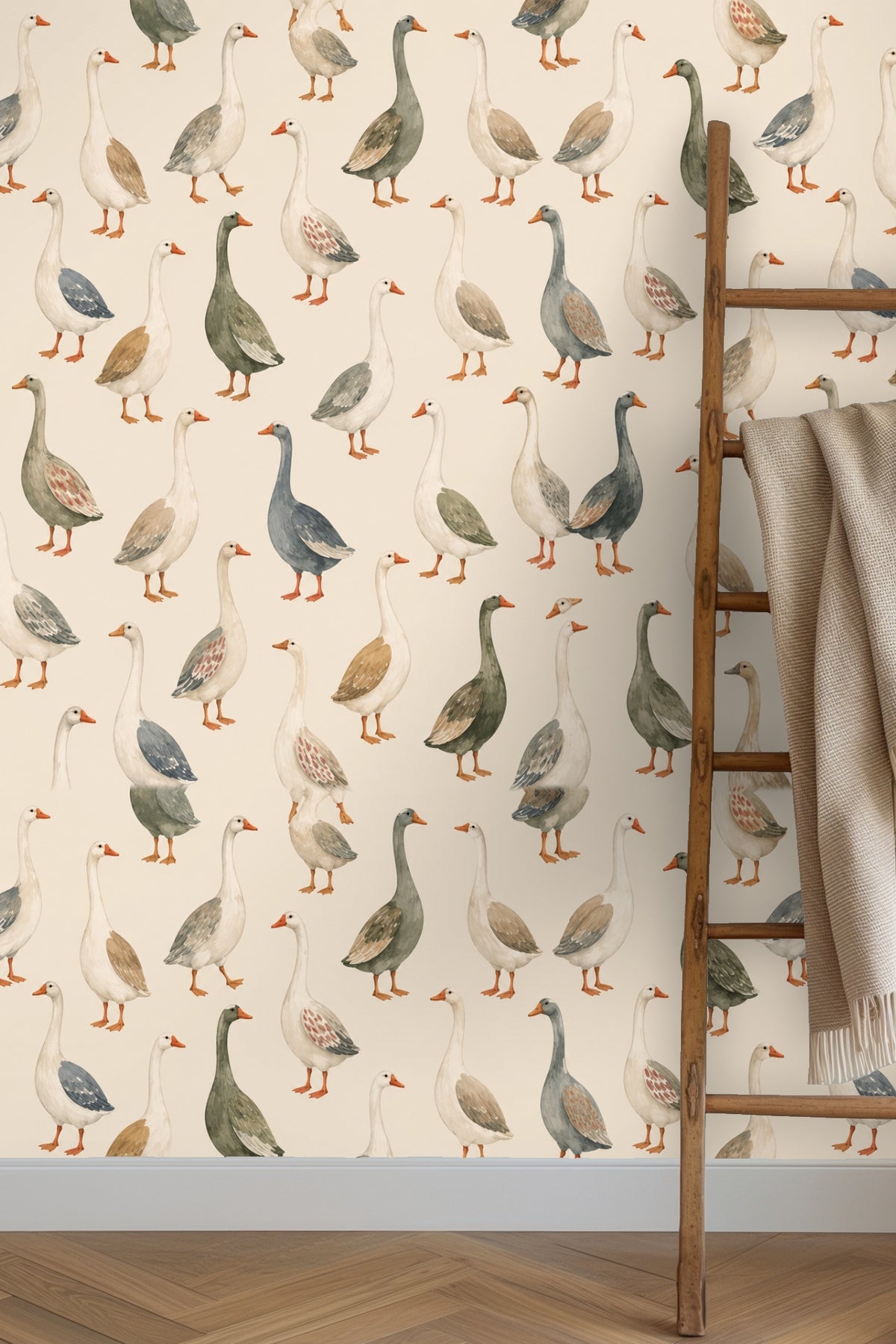 Living room wall with gathered geese wallpaper behind a plush blue velvet sofa