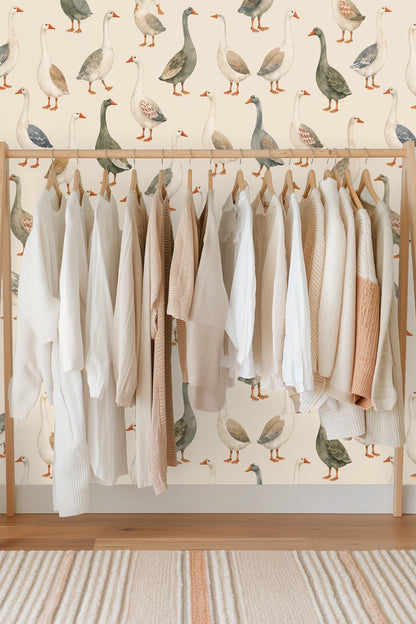 Softly colored geese standing in varied poses in a repeating wallpaper pattern