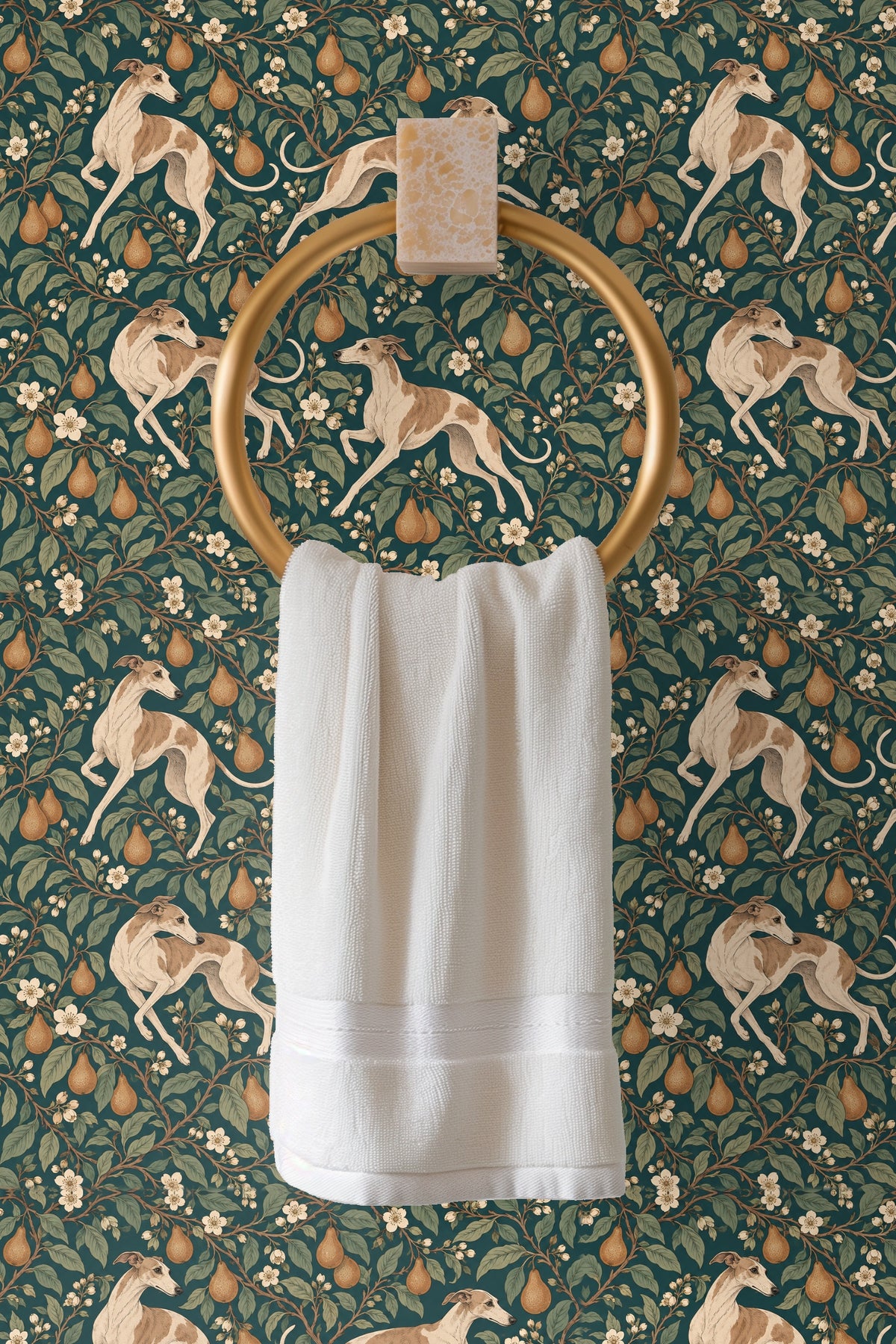 Detailed shot of golden pears and white blossoms framed by leaves on a rich teal wallpaper