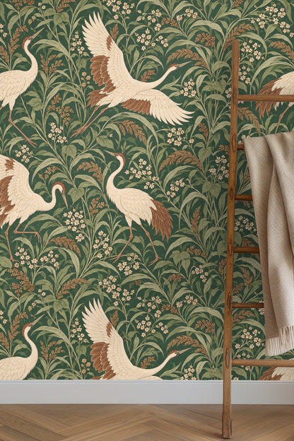 Decorative vignette with candle, flowers, and wallpaper background
