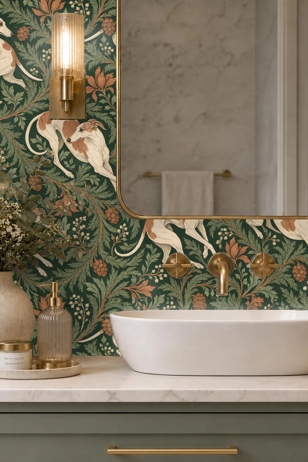 Bathroom wall vignette showing wallpaper with whippets and botanical motifs around a white oval sink and brass fixtures
