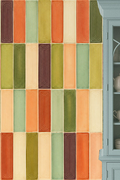 Color blocks in shades of terracotta, olive green, light cream and muted plum