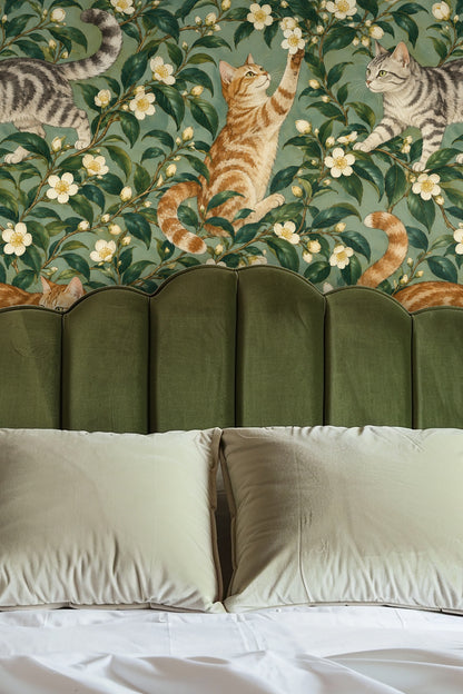 Close-up of wallpaper pattern depicting detailed gray tabby cat walking across camellia branches with white flowers.