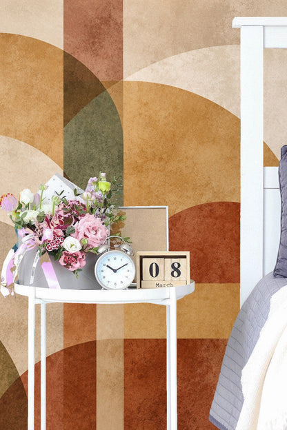 Softly worn look of overlapping arched shapes in terracotta and green hues