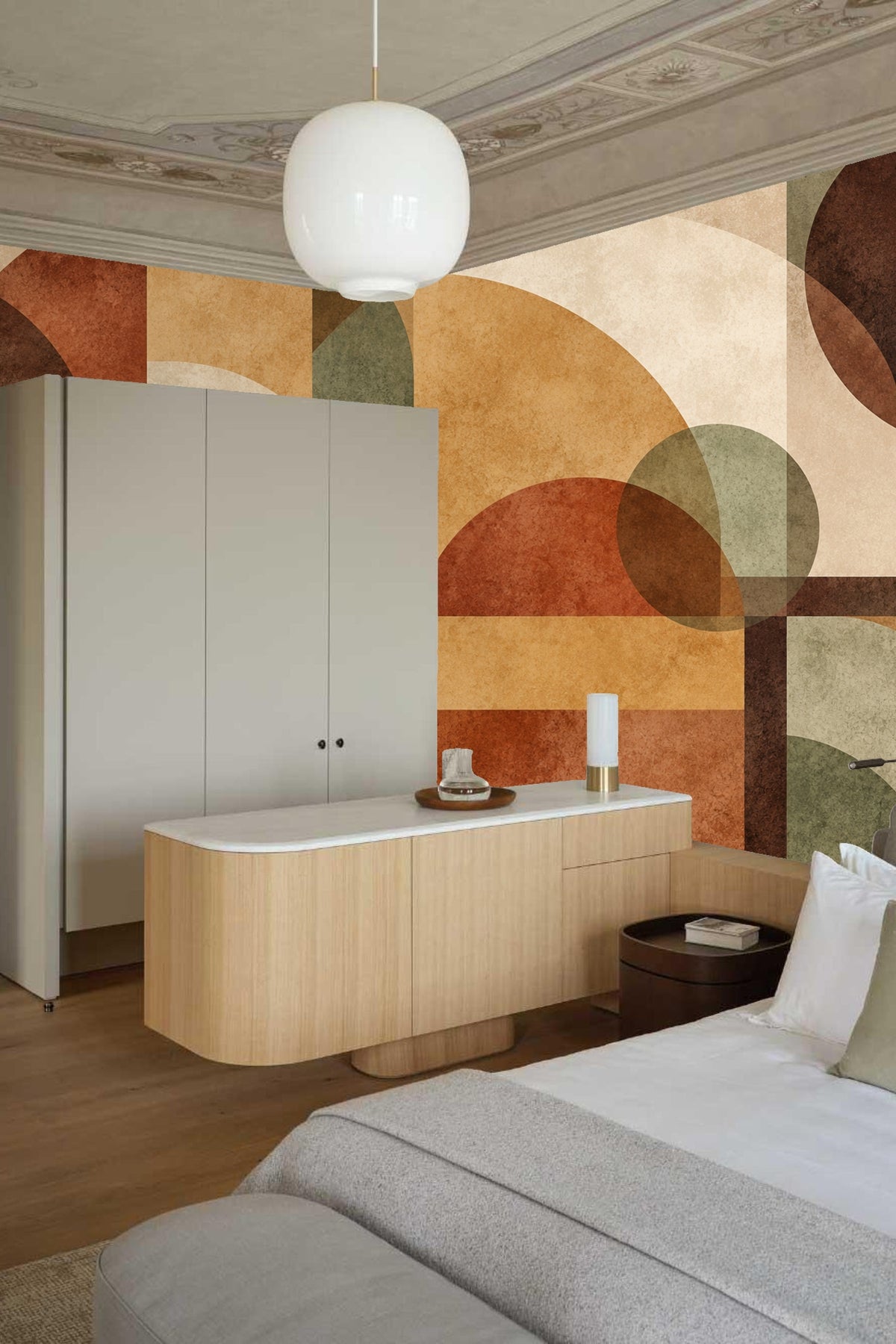 Close-up of textured overlapping arches and rectangles in warm and muted earth tones