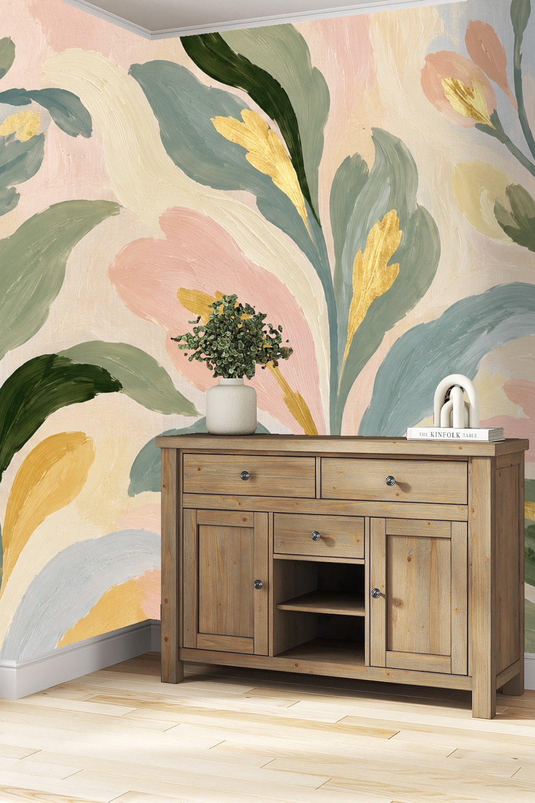 Muted green and blush leaves flowing in organic shapes on wallpaper