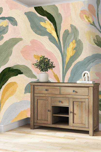 Muted green and blush leaves flowing in organic shapes on wallpaper