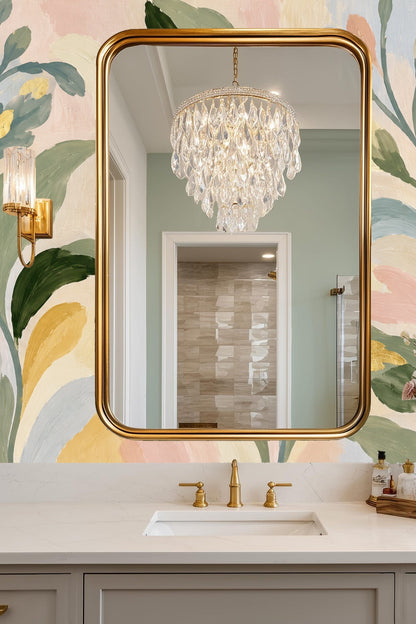 Bedroom with large-scale botanical wallpaper in soft pastels and gold highlights
