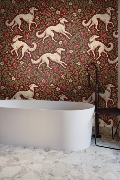 Pomegranate fruits with seed details intertwined with curling green leaves on dark red wallpaper