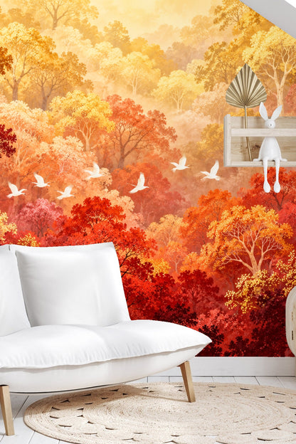 White birds flying diagonally across a richly colored fall forest backdrop.
