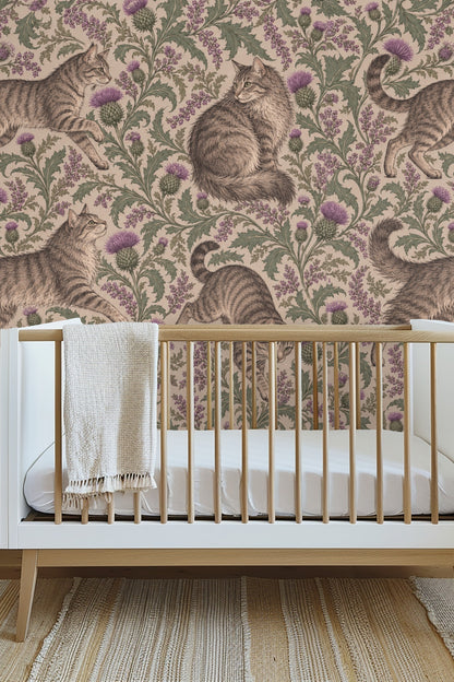 Tabby cat sitting surrounded by mauve thistle blooms and green leaves on beige background