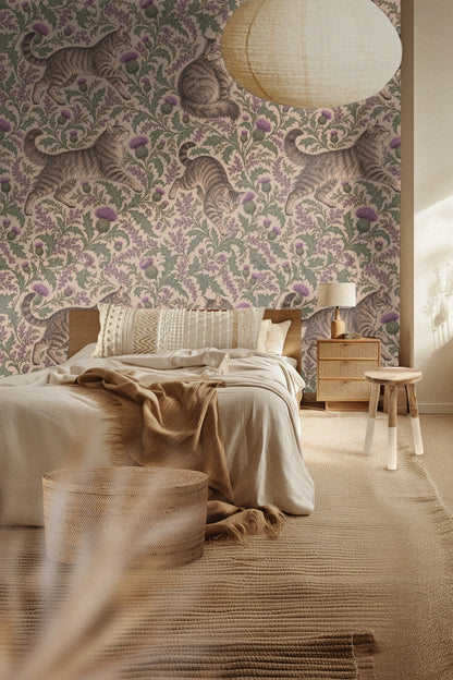 Close-up of wall with wallpaper featuring tabby cats and thistle plants next to wooden blanket ladder