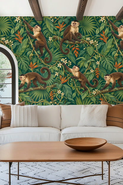 Living room scene showing wallpaper with monkeys in tropical foliage behind a resting golden retriever in bed