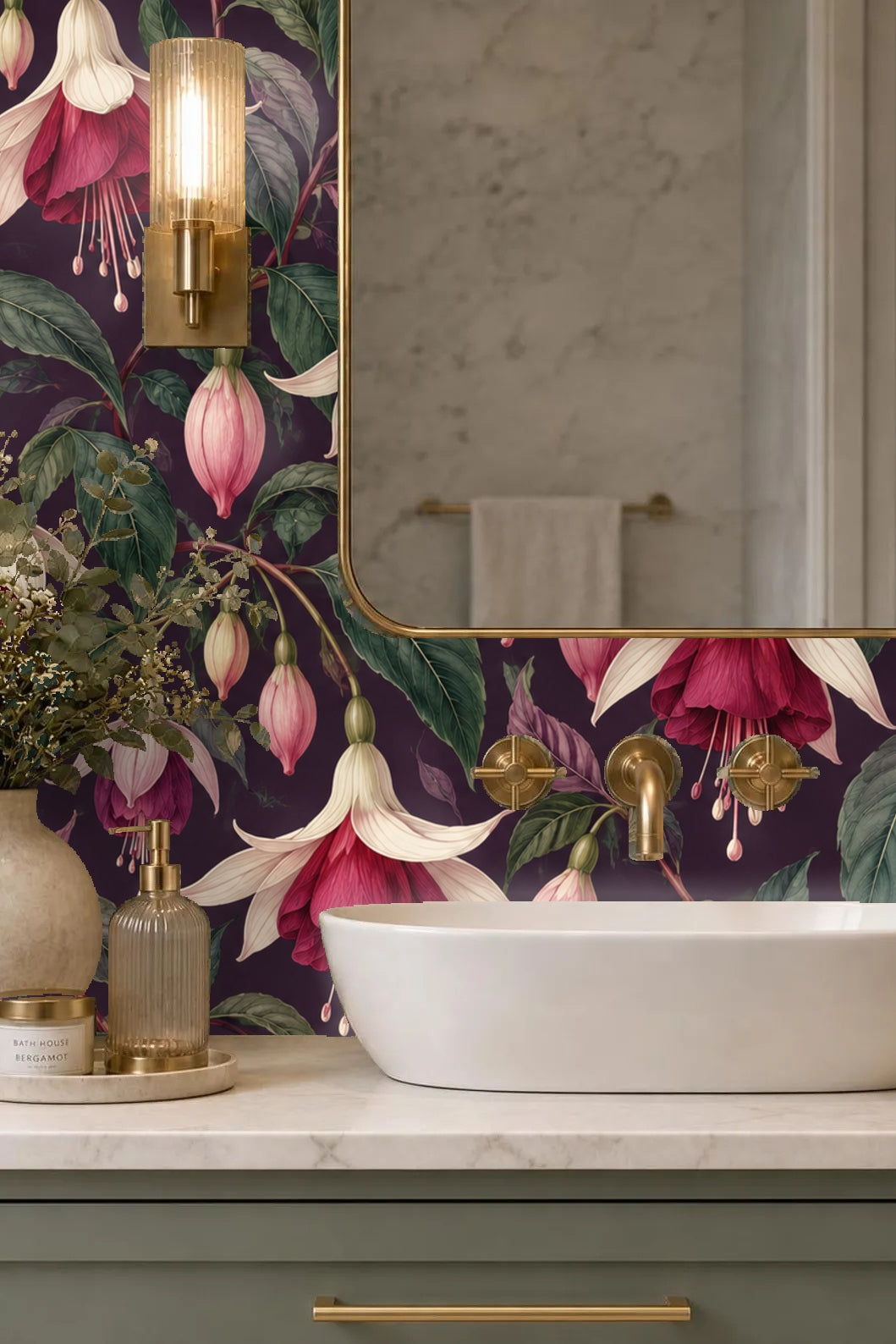 Close-up of delicate fuchsia flowers with hanging pink petals on deep plum wall