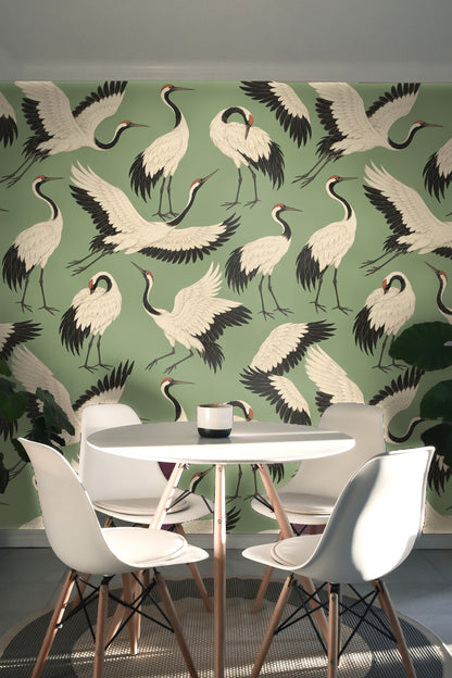 Detailed illustration of flying and standing cranes on harmonious green wallpaper surface.