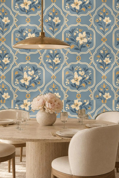 Shelving and towels placed against blue floral wallpaper background
