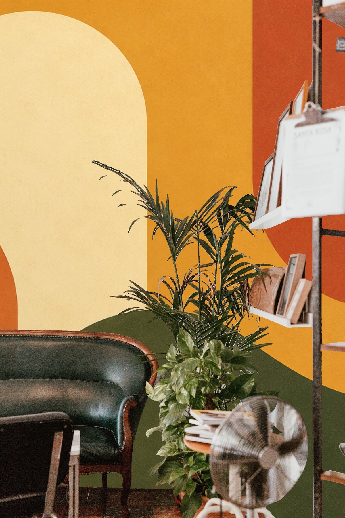 Bedroom corner with the mural wallpaper, decorated with modern light fixture and minimal furnishings.