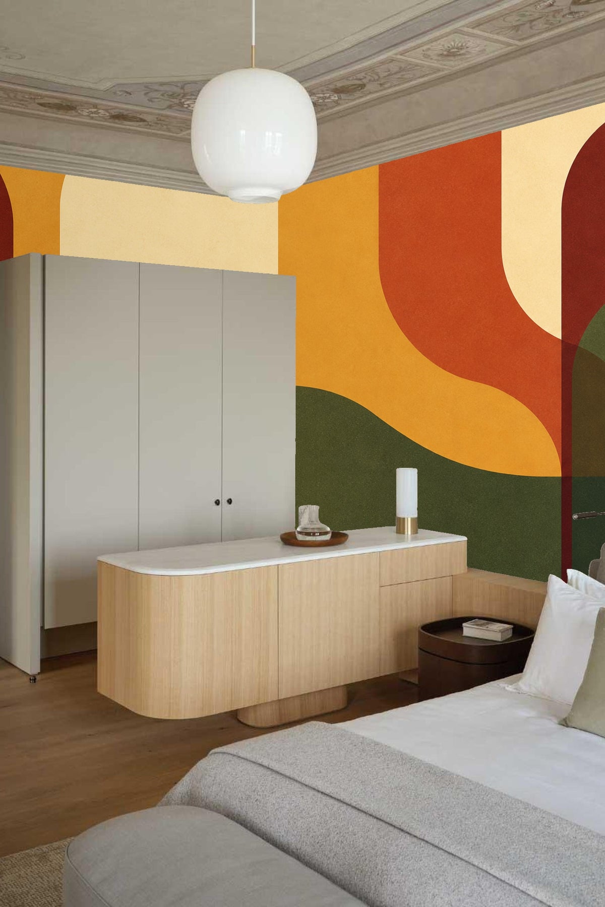 Detail of wallpaper applied in a child's room featuring a wooden chair resembling antlers.
