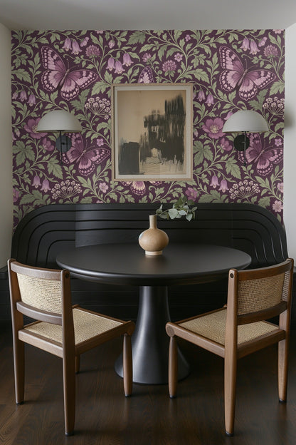 Butterfly wings with intricate markings and soft mauve color on floral wallpaper