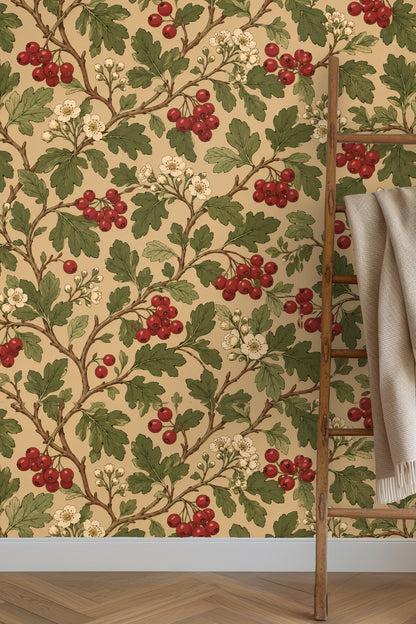 Bedroom wall covered in wallpaper with red berries and green leaves behind bed and windows