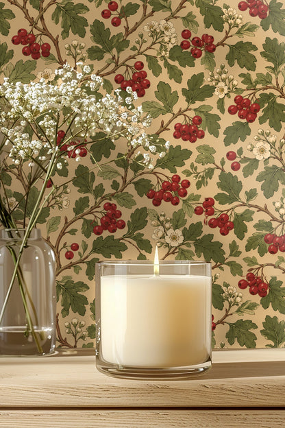Living room detail featuring the wallpaper behind a lit candle and flower arrangement