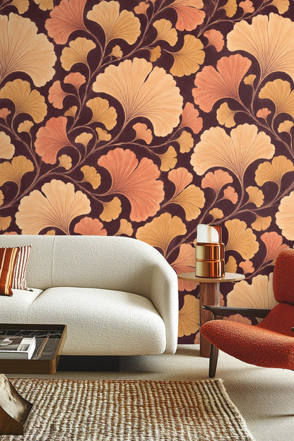 Ambient light enhancing warm tones of botanical wallpaper behind wooden furniture.