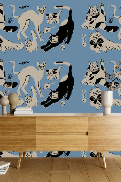 Bedroom setting featuring the blue cat wallpaper with wood furniture and earthy accents