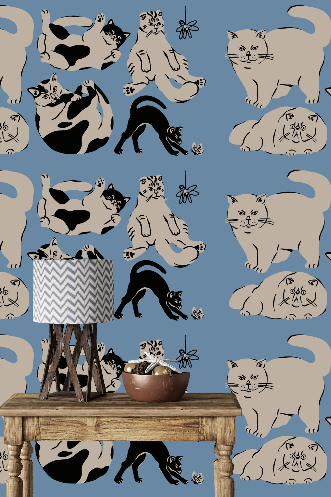 Cream cat with line details sitting with paws forward