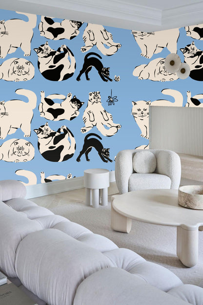 Hanging flower toy detail on wallpaper with cat motifs